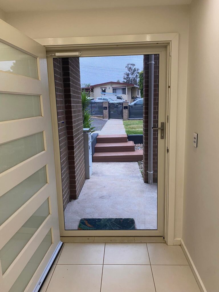 ScreenGuard ScreenGuard security screen door on front entrance installed by Olsen Security