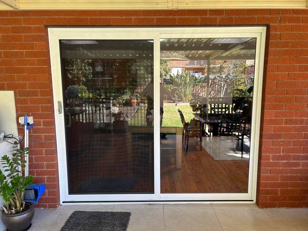 Our Projects ScreenGuard security sliding door on sliding door opening to outdoor area installed by Olsen Security