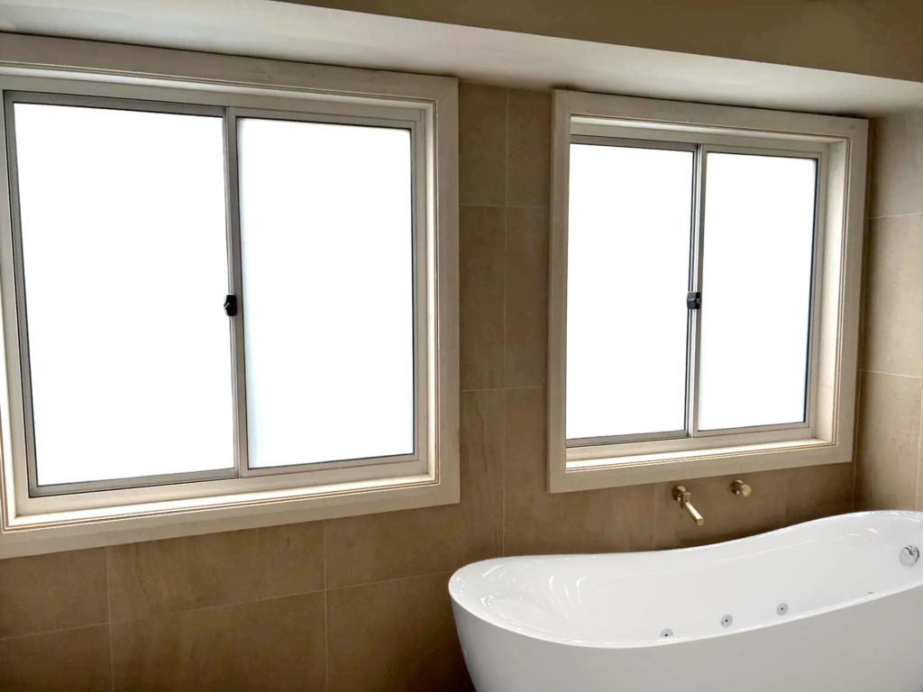 Our Projects Aluminium sliding windows installed in bathroom by Olsen Security