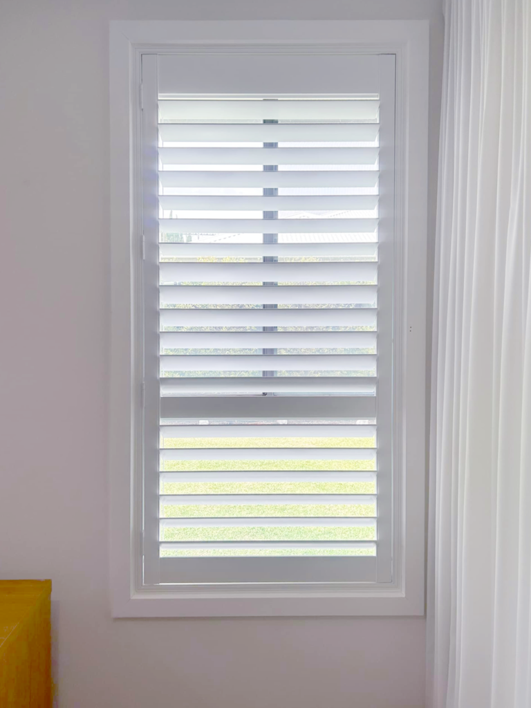 Plantation shutters, blinds, shades & privacy screens Plantation shutters on sliding windows in bedroom installed by Olsen Security