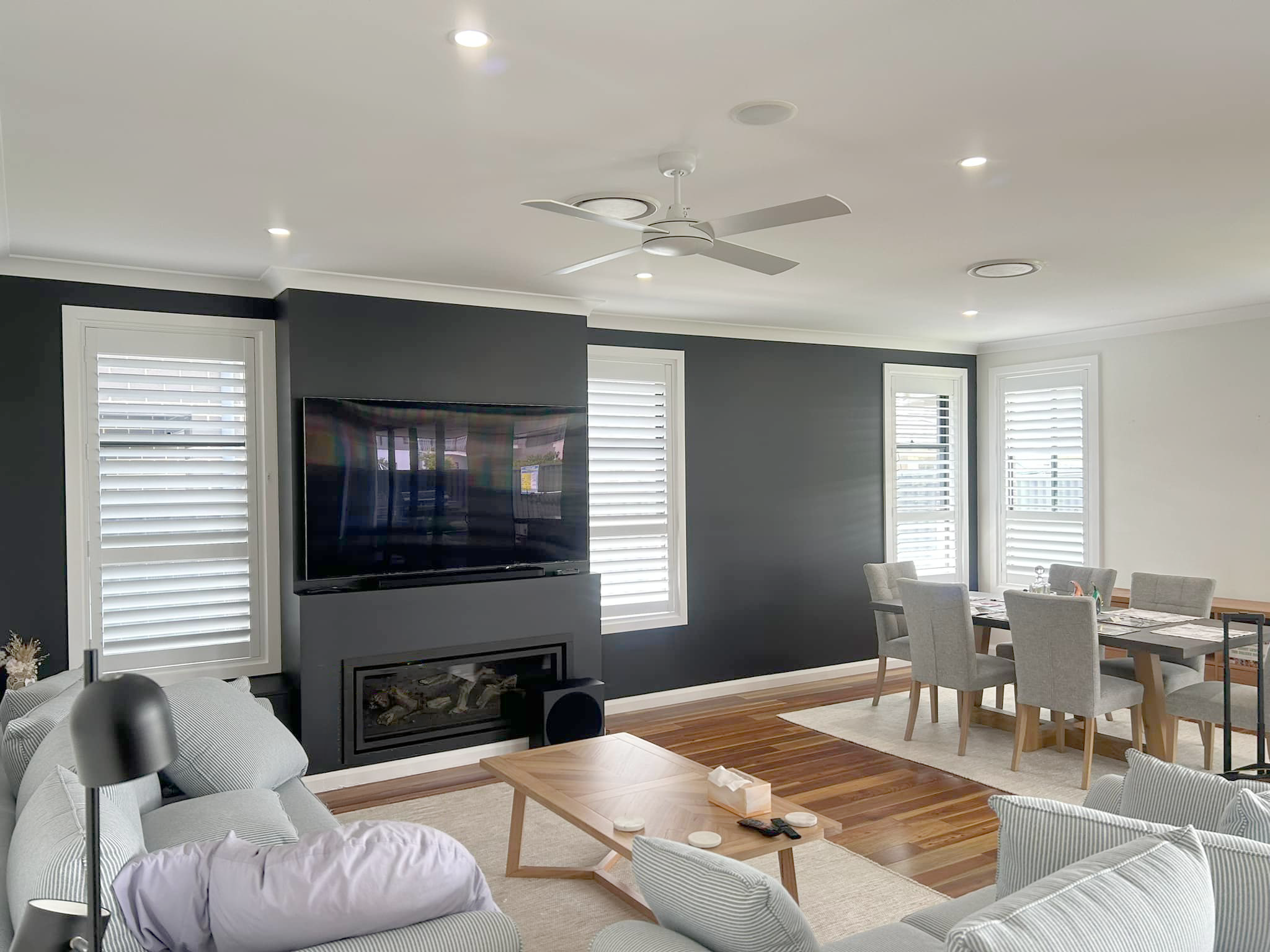 Plantation shutters, blinds, shades & privacy screens Plantation shutters on sliding windows and double-hung windows in living room and dining room installed by Olsen Security