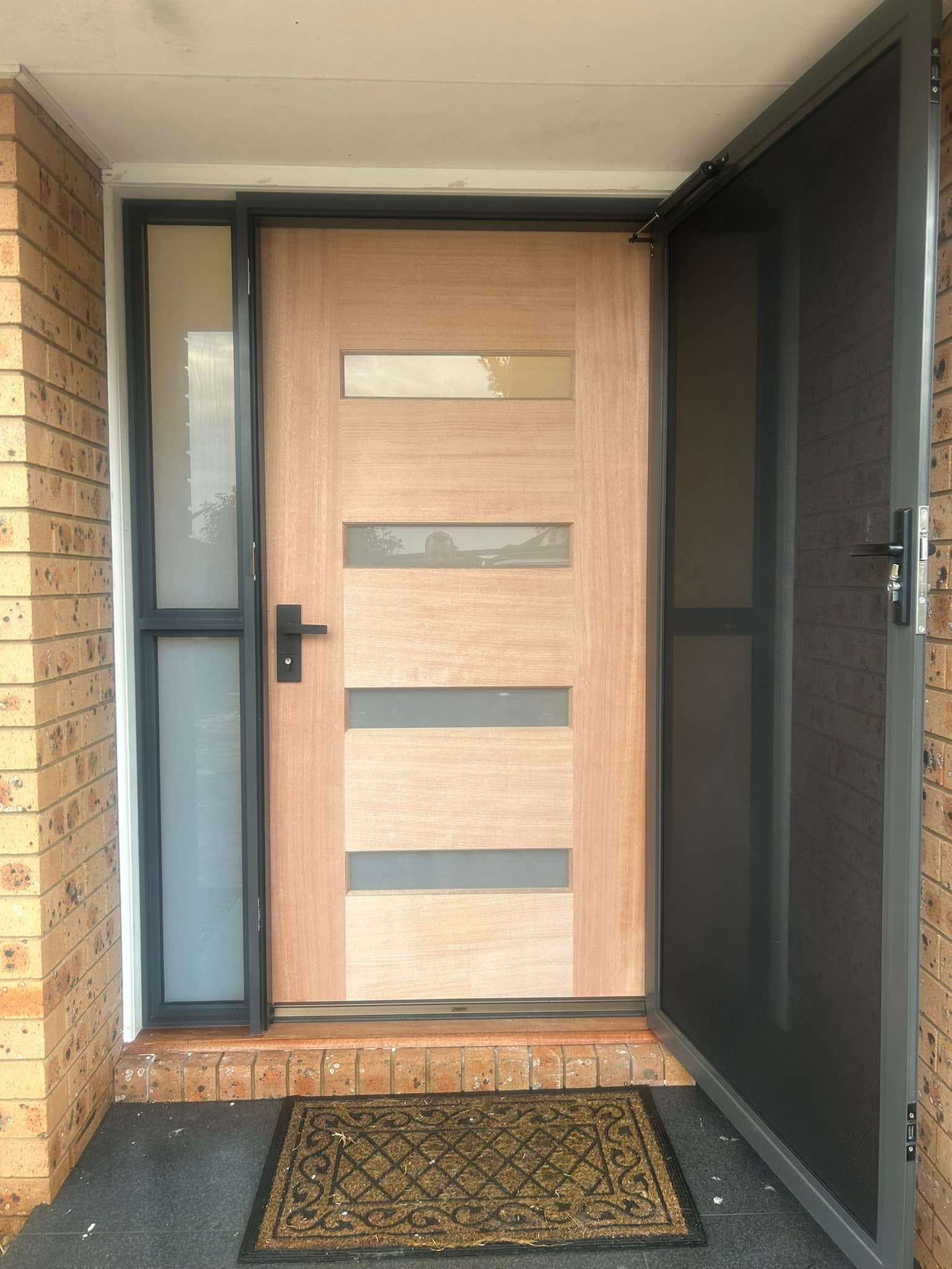 ScreenGuard security screen door on timber entrance door with sidelights installed by Olsen Security