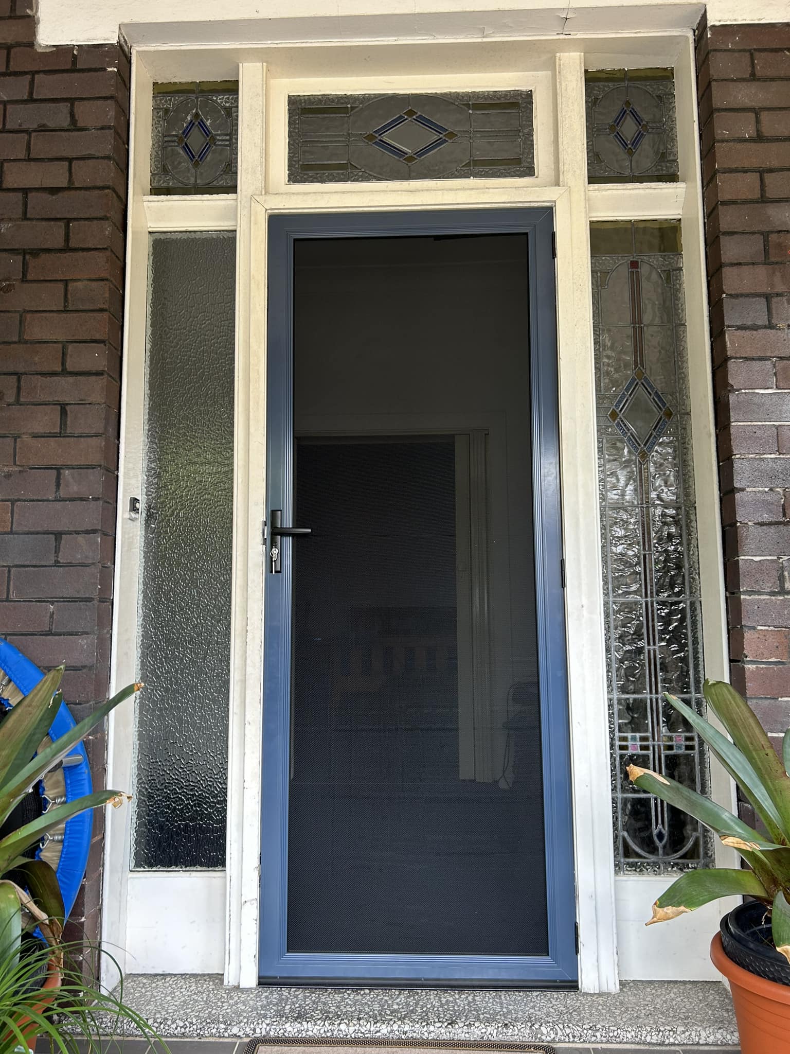 ScreenGuard ScreenGuard security screen door on front entrance installed by Olsen Security