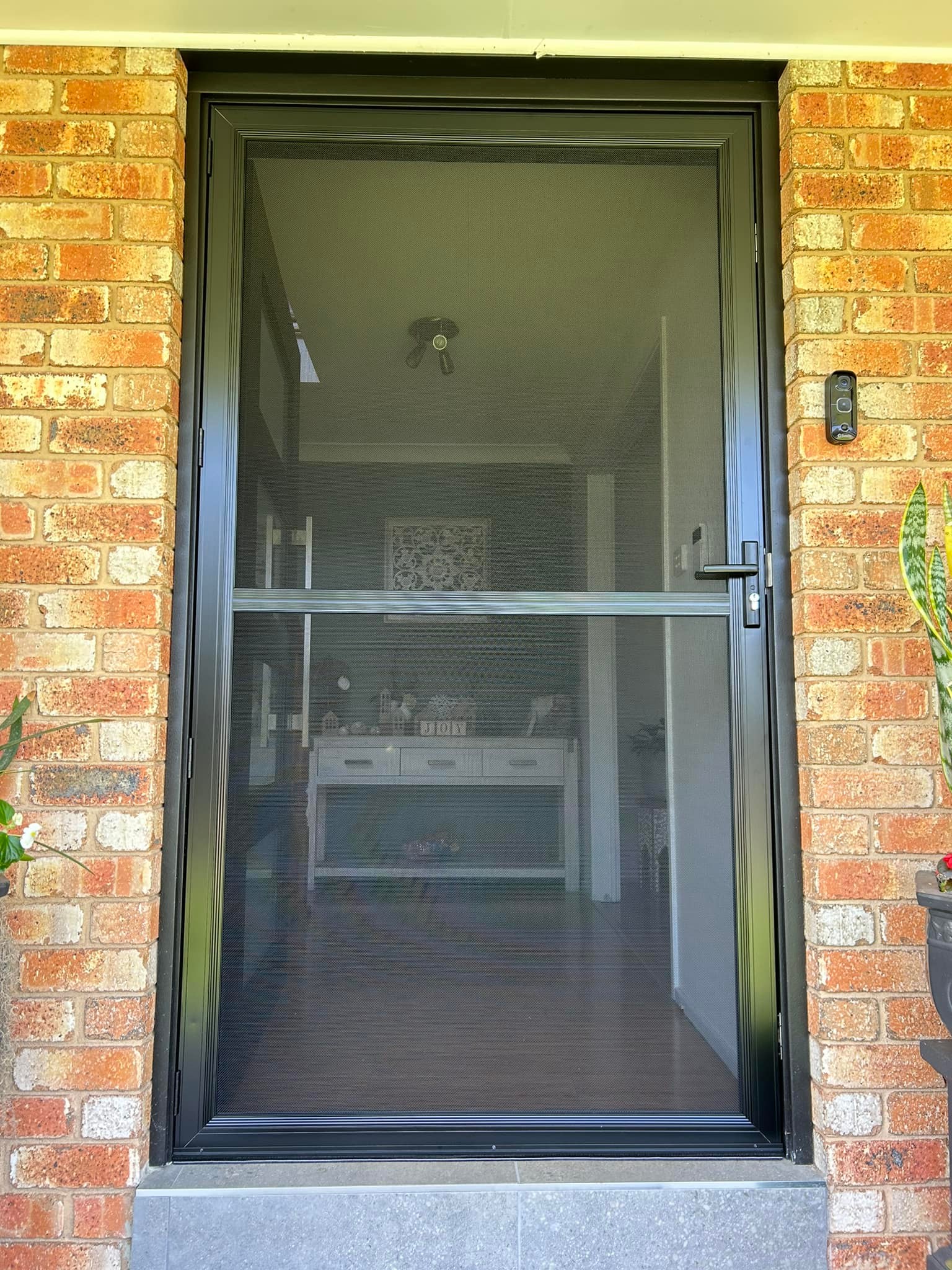 ScreenGuard ScreenGuard security screen door on front entrance installed by Olsen Security