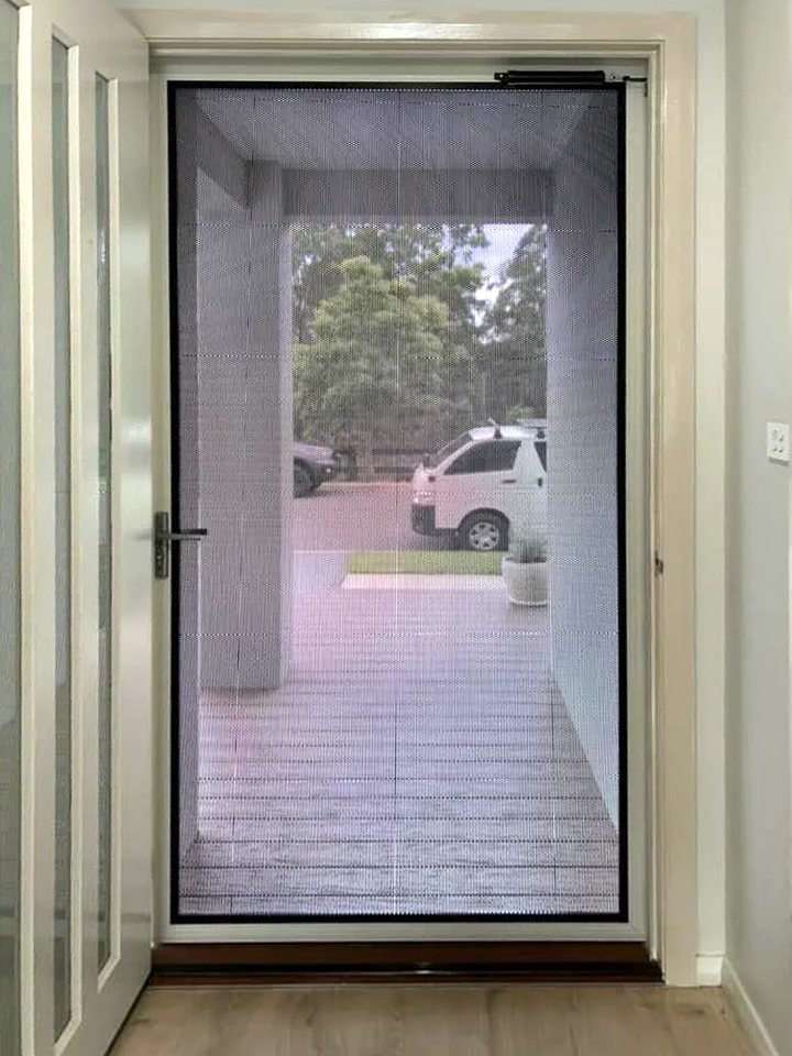 Security screen door on front entrance installed by Olsen Security