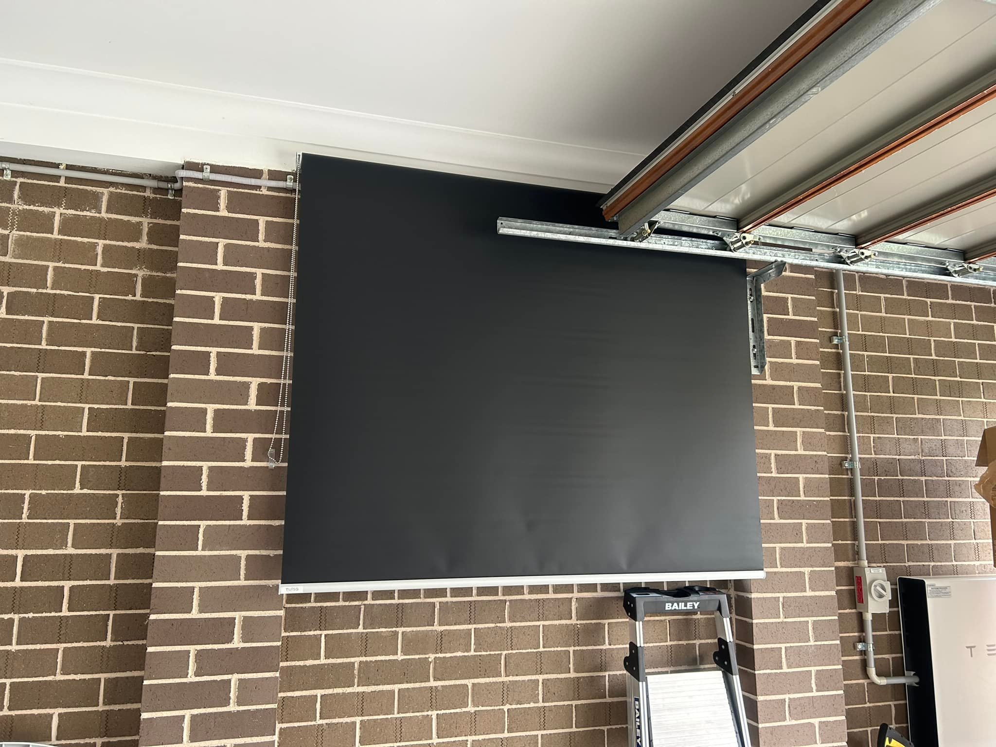 Plantation shutters, blinds, shades & privacy screens Roller blinds on sliding windows in workshop installed by Olsen Security