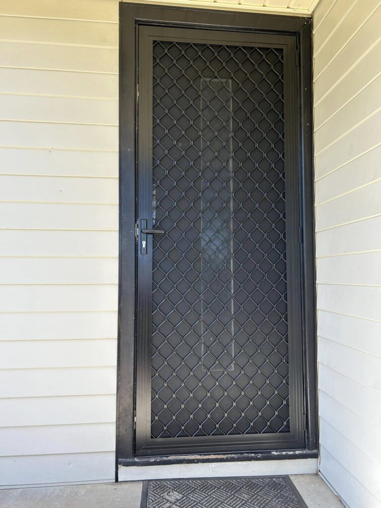 Security grill door with heavy-duty flyscreen installed by Olsen Security