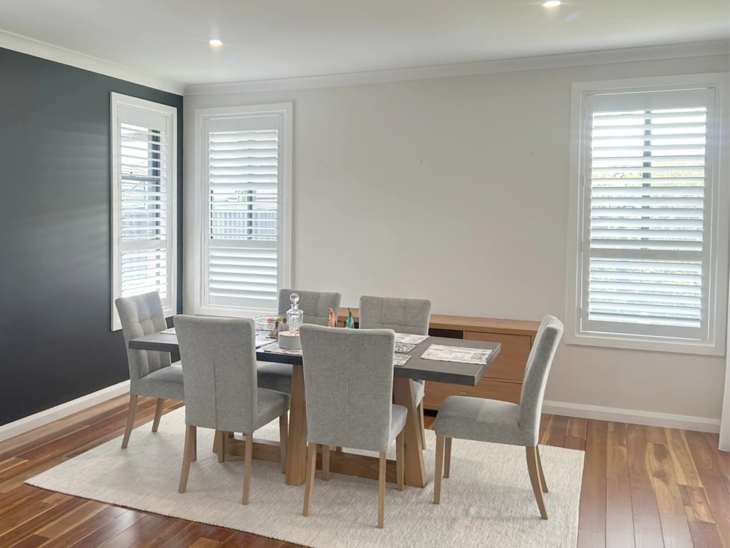 Plantation shutters, blinds, shades & privacy screens Plantation shutters on sliding windows and double-hung windows in living room and dining room installed by Olsen Security