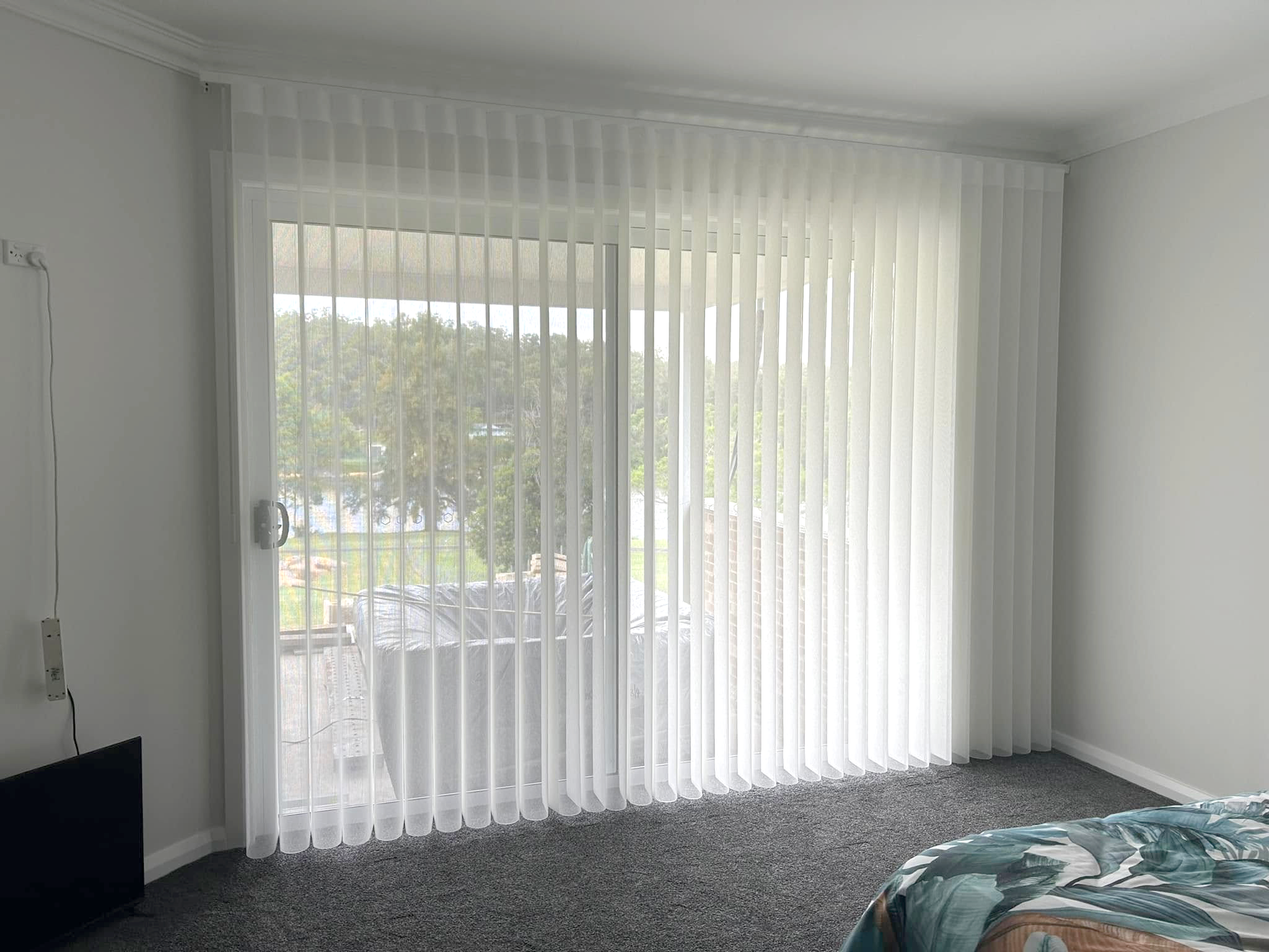 Plantation shutters, blinds, shades & privacy screens Verishade blinds on sliding doors in bedroom installed by Olsen Security