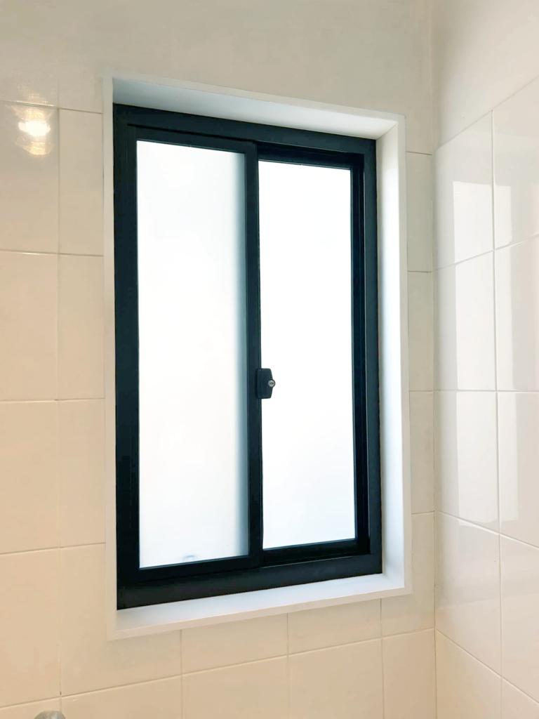 Our Projects Aluminium sliding window installed in bathroom by Olsen Security