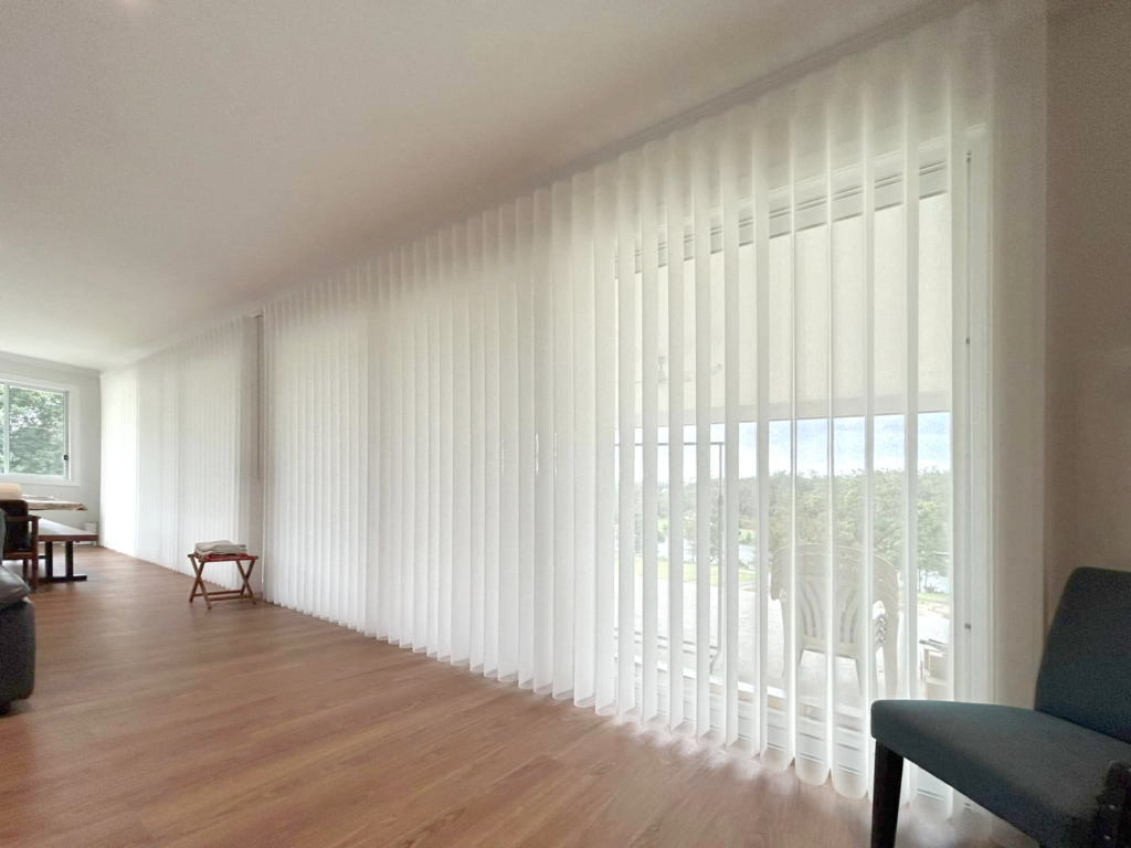 Plantation shutters, blinds, shades & privacy screens Verishade blinds on sliding doors in living room installed by Olsen Security