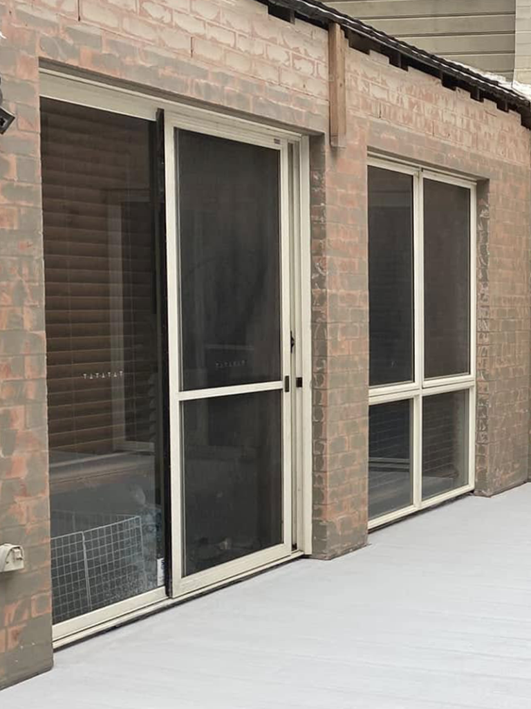 JDS Construction & Design - ScreenGuard security sliding doors on sliding doors opening to outdoor area, and ScreenGuard security mesh on sliding windows installed by Olsen Security