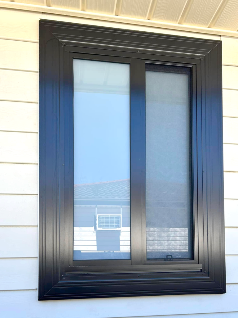 Our Projects Sliding window with flyscreen installed in bathroom by Olsen Security