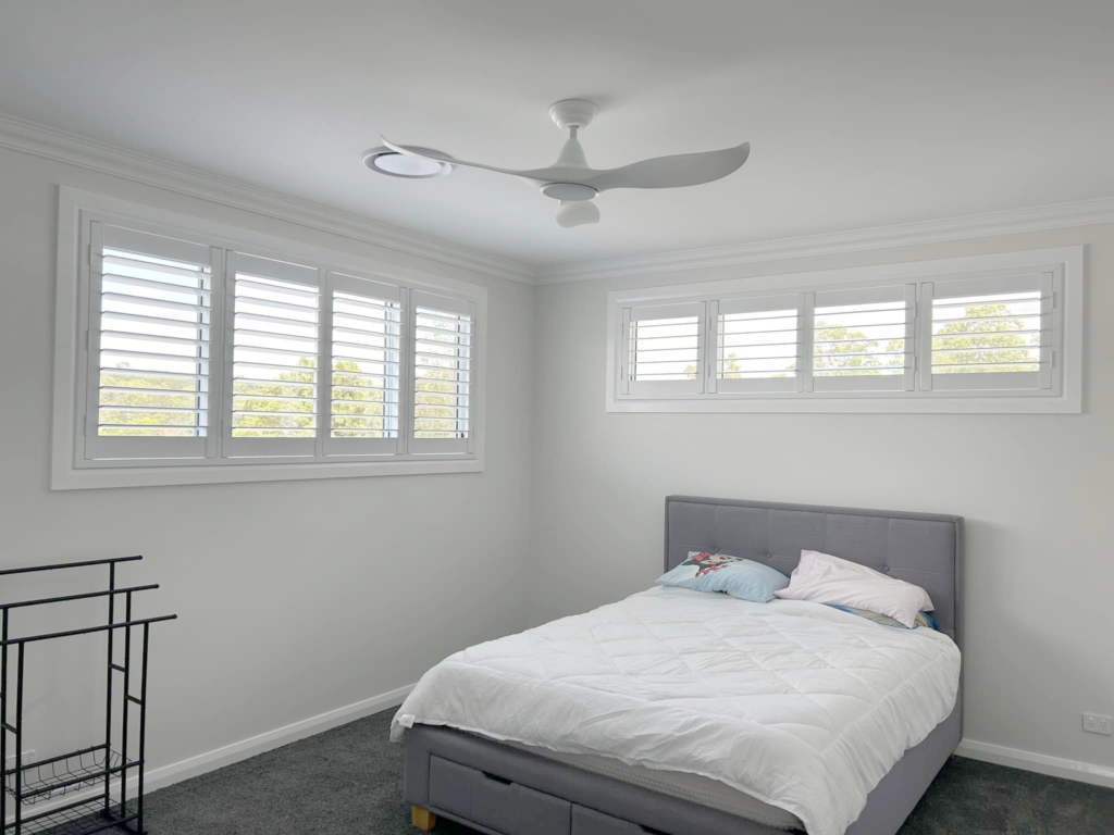 Plantation shutters, blinds, shades & privacy screens Plantation shutters on sliding windows in bedroom installed by Olsen Security