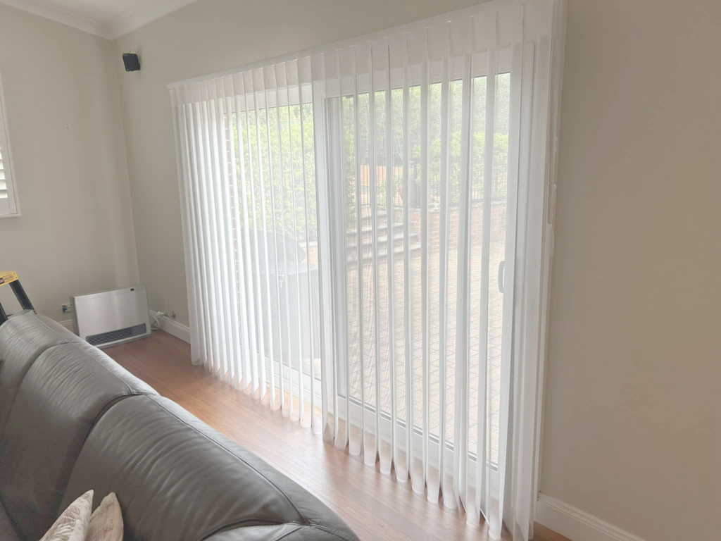 Plantation shutters, blinds, shades & privacy screens Verishade blinds on sliding doors in living room installed by Olsen Security.