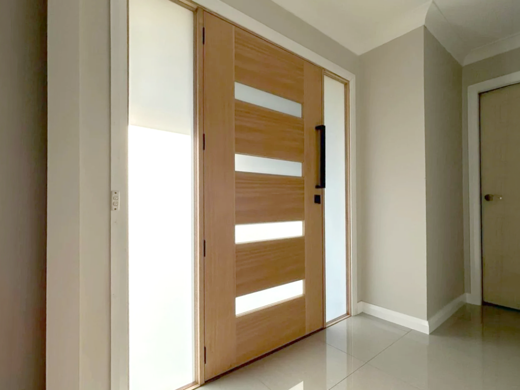 Timber entrance door with sidelights installed by Olsen Security