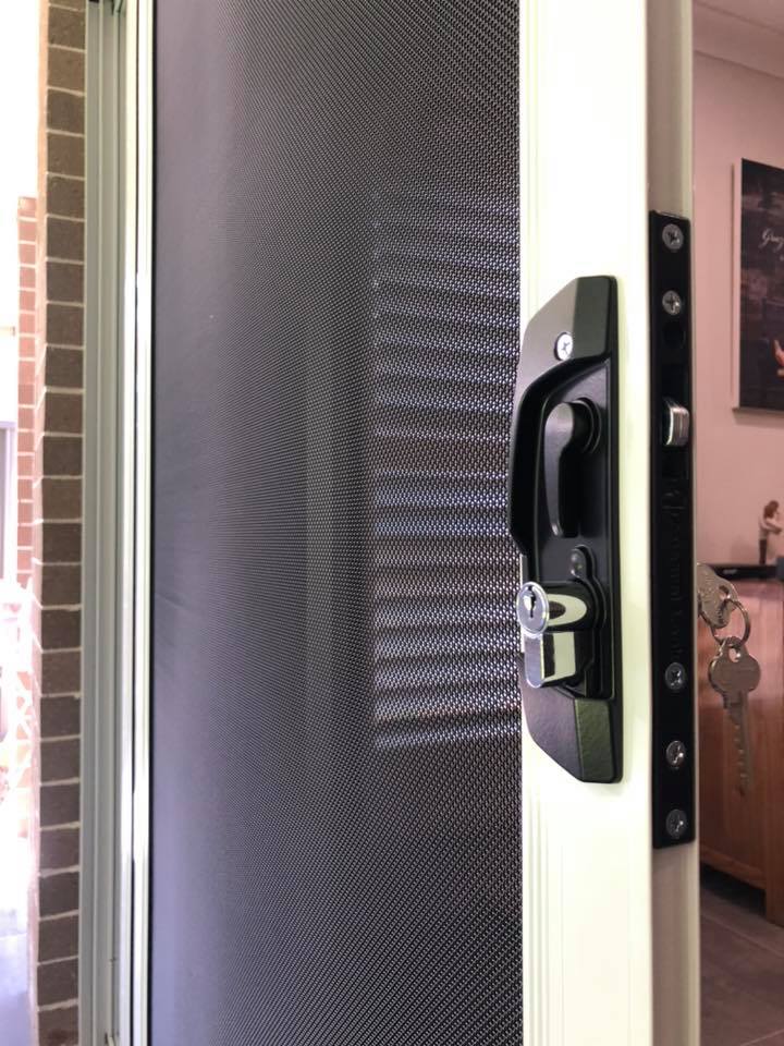 Door lock on ScreenGuard security mesh hinged door installed by Olsen Security
