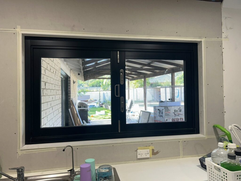 Our Projects Bi-fold windows opening to outdoor entertainment area installed by Olsen Security
