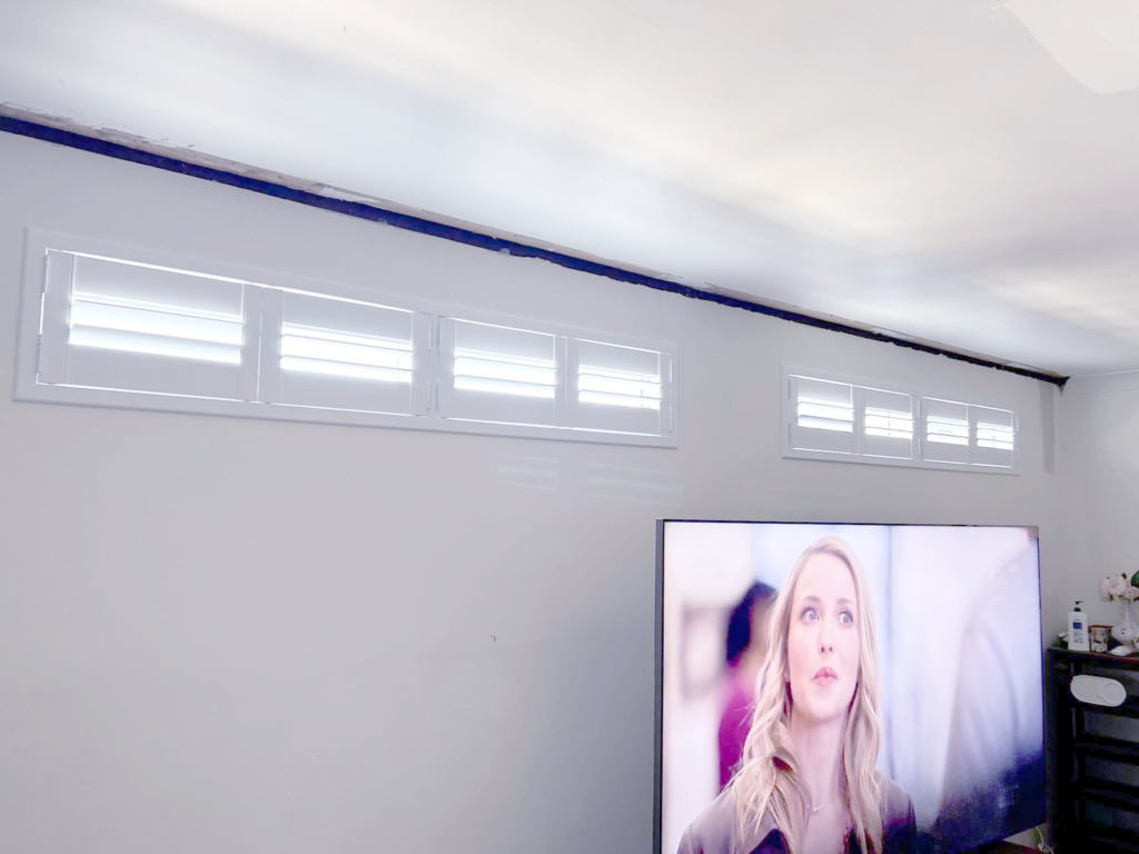 Plantation shutters, blinds, shades & privacy screens Plantation shutters on small windows in den installed by Olsen Security