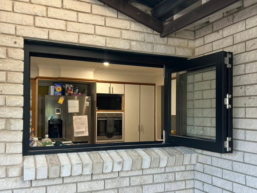 Our Projects Bi-fold windows opening to outdoor entertainment area installed by Olsen Security
