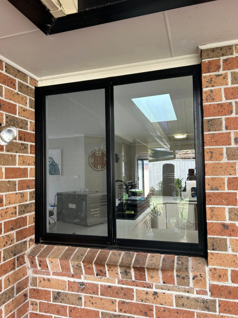 Our Projects Sliding window with flyscreen installed in kitchen by Olsen Security