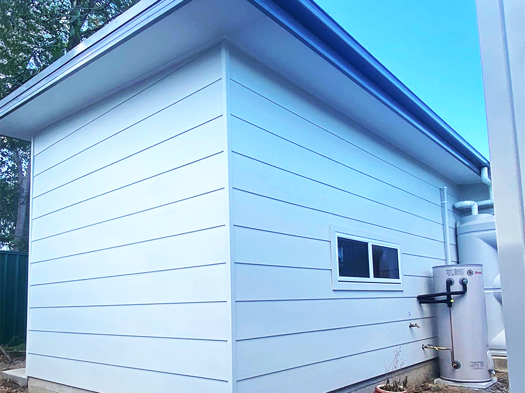 JDS Construction & Design - Flyscreen window on sliding windows in granny flat installed by Olsen Security