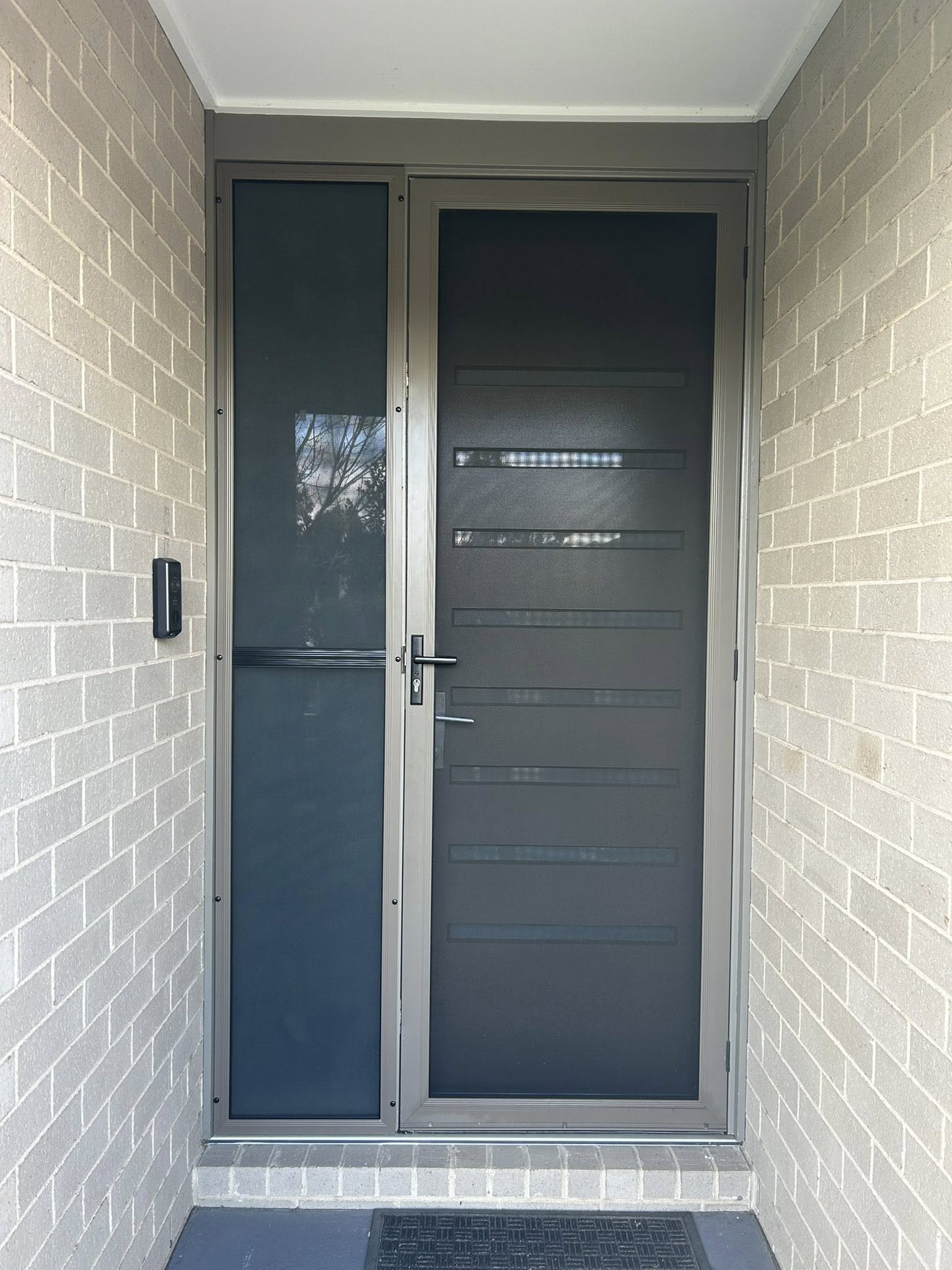 ScreenGuard ScreenGuard security screen door on front entrance and ScreenGuard mesh sidelight installed by Olsen Security