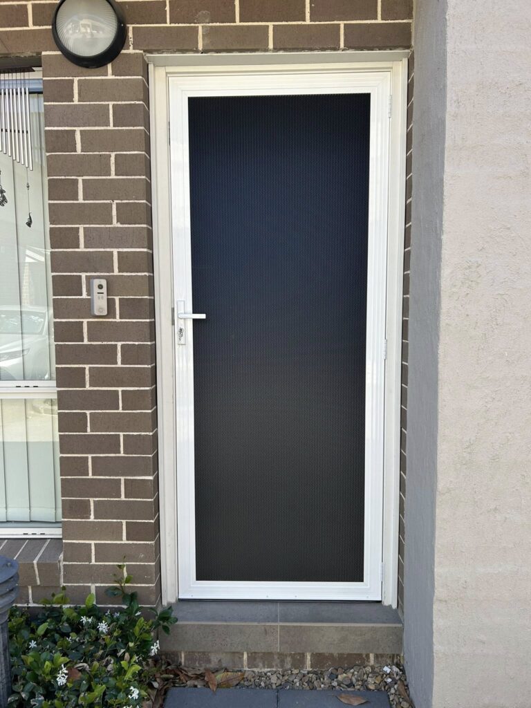 ScreenGuard ScreenGuard security screen door on front entrance installed by Olsen Security
