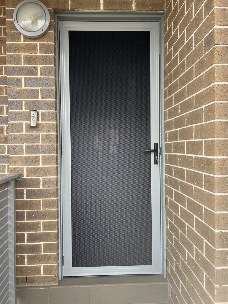 ScreenGuard ScreenGuard security screen door on front entrance installed by Olsen Security