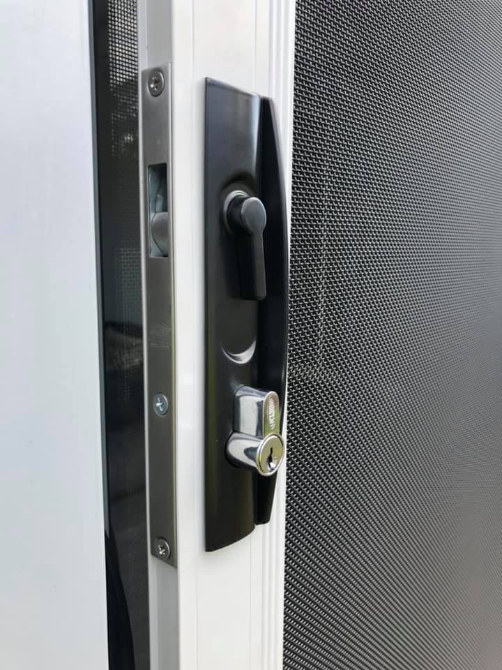 Door lock on ScreenGuard security mesh hinged door installed by Olsen Security 