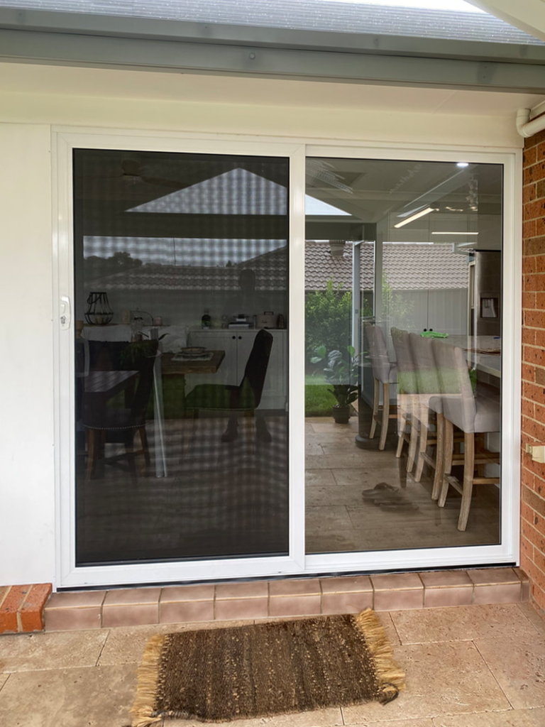 Our Projects ScreenGuard security sliding door on sliding door opening to outdoor area installed by Olsen Security