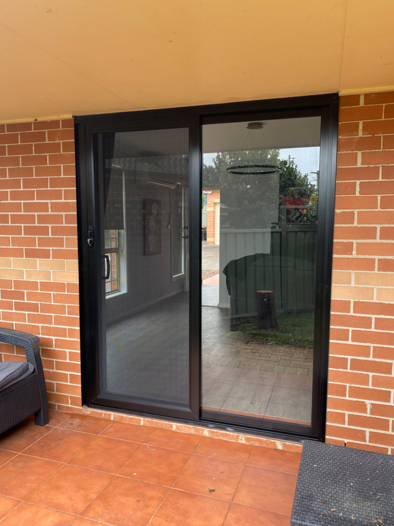 Our Projects ScreenGuard security sliding door on sliding door opening to patio installed by Olsen Security