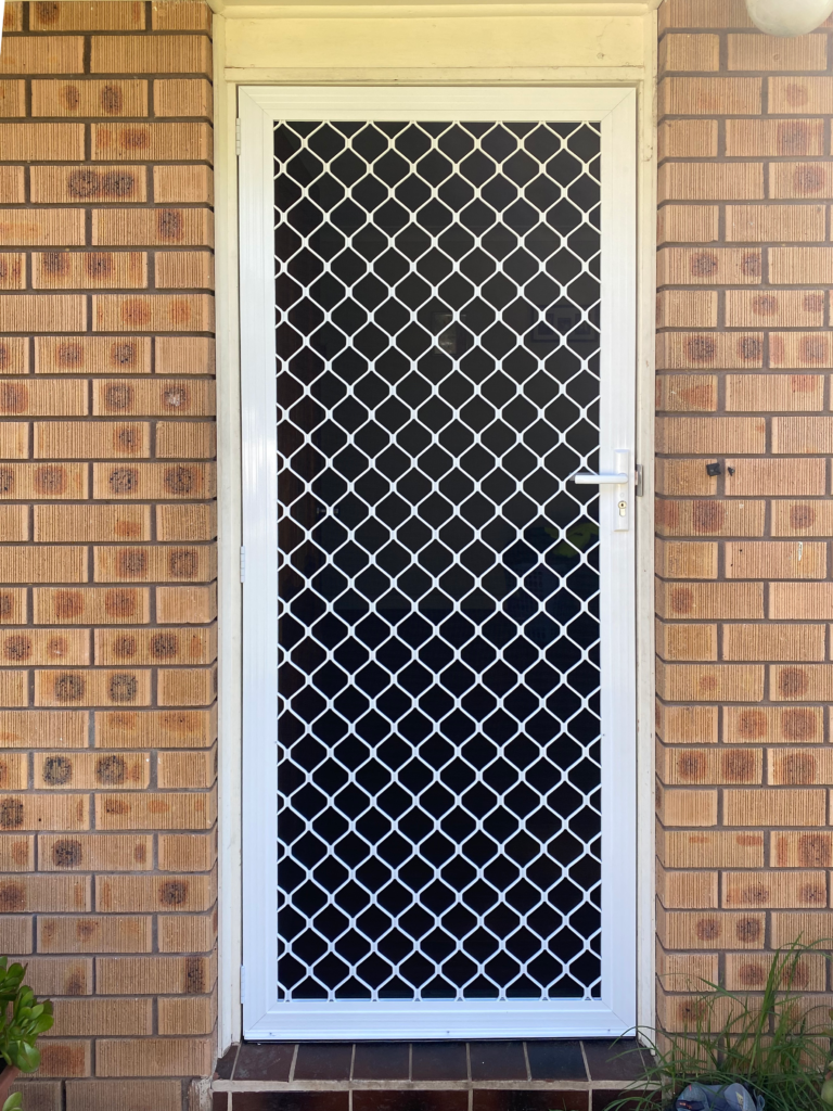 Security grill and mesh door on front entrance installed by Olsen Security