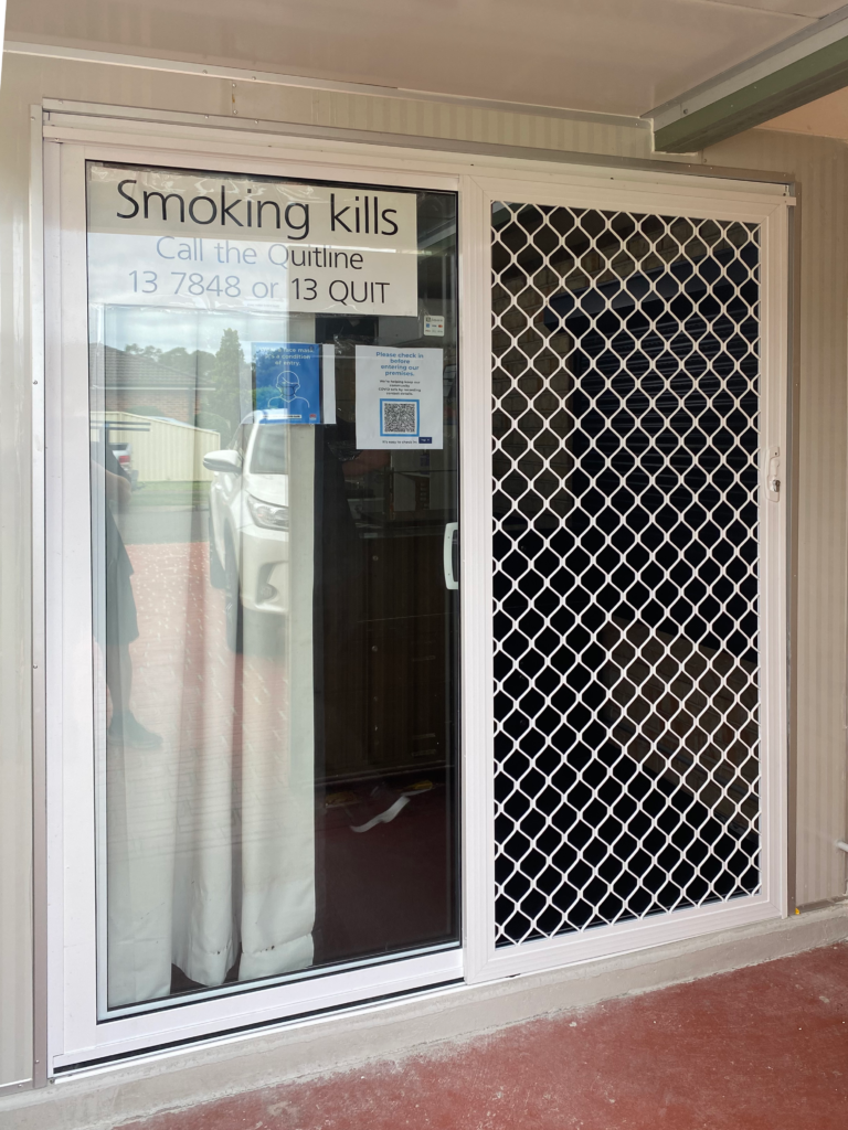 Sliding security grill door on sliding door installed by Olsen Security