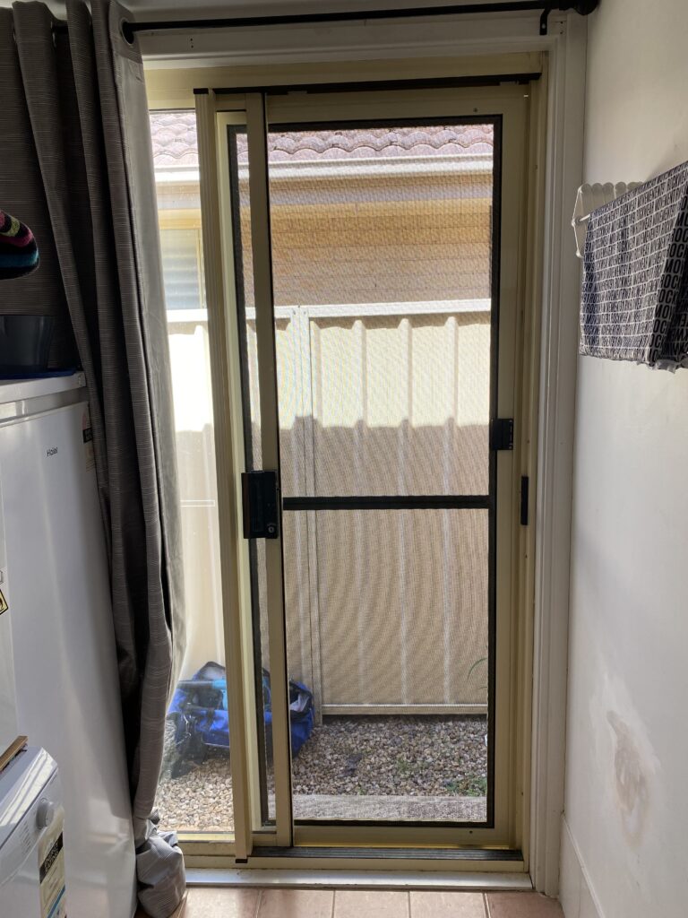 Flyscreen sliding door on sliding door installed by Olsen Security