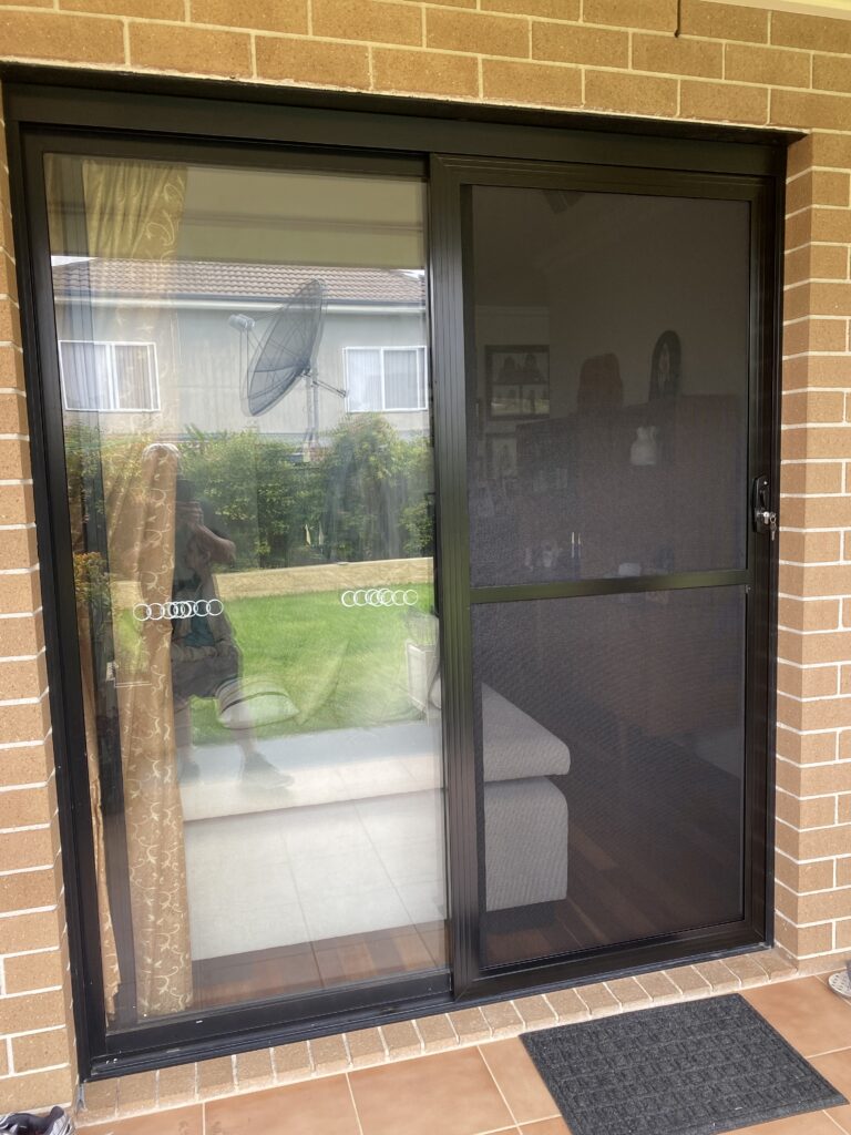 Flyscreen sliding door on sliding door installed by Olsen Security