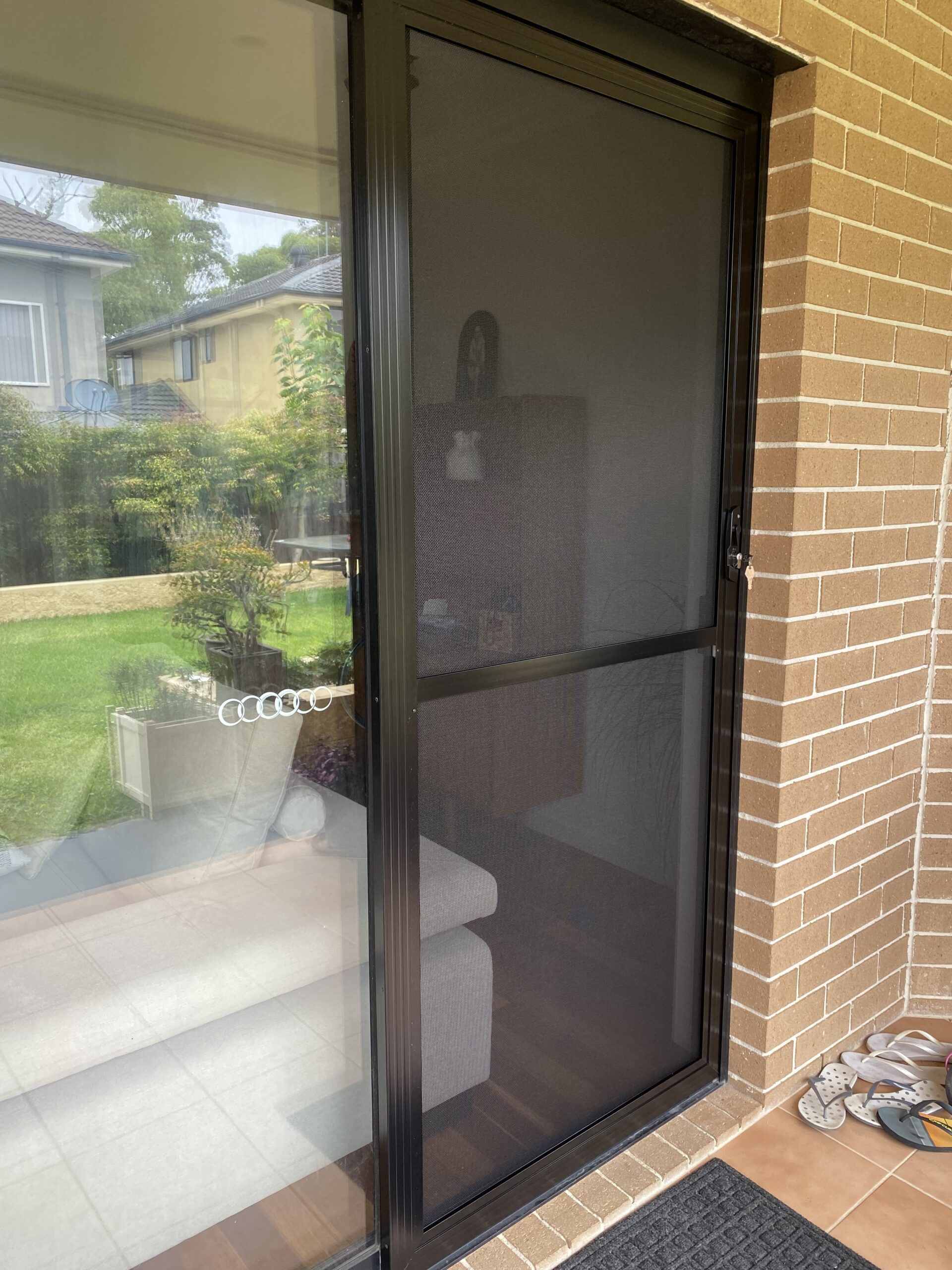 Flyscreen sliding door on sliding door installed by Olsen Security