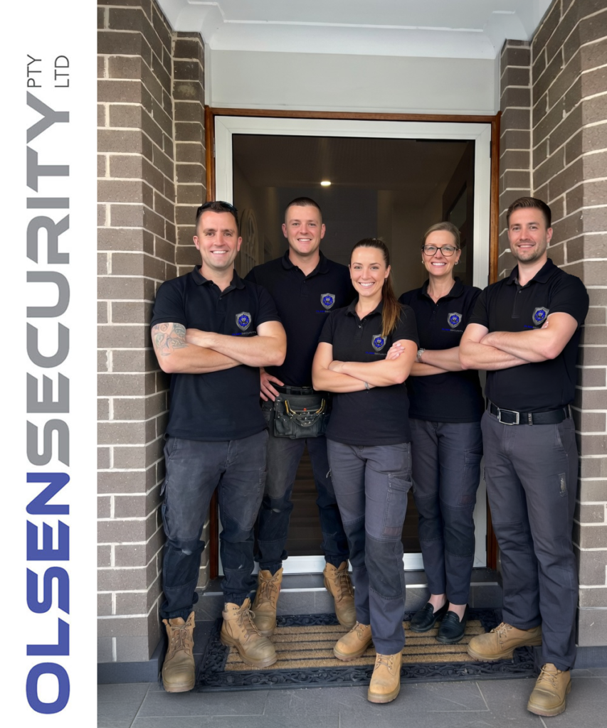 Nathan Olsen and Olsen Security Team standing in front of ScreenGuard security hinged front door