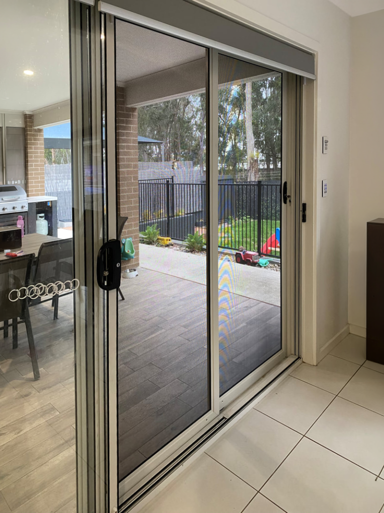 ScreenGuard ScreenGuard security sliding door on sliding door opening to outdoor entertainment area installed by Olsen Security