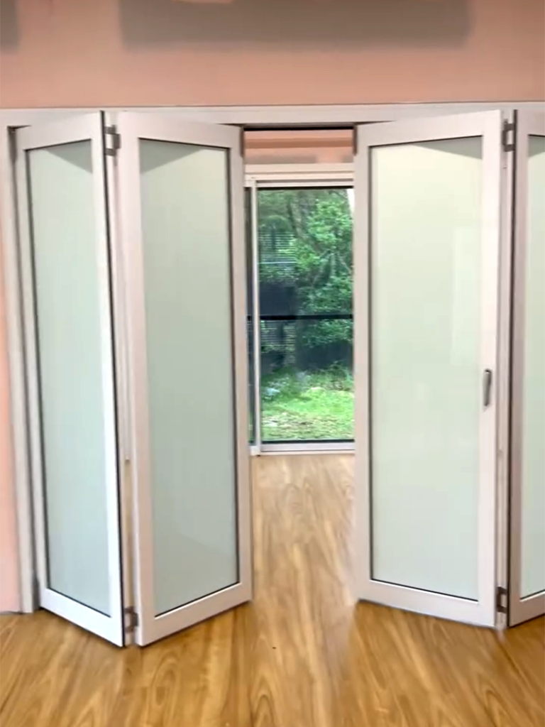 JDS Construction & Design - Stacker doors opening to adjoining living rooms, and ScreenGuard security sliding doors on sliding doors opening to outdoor area installed by Olsen Security