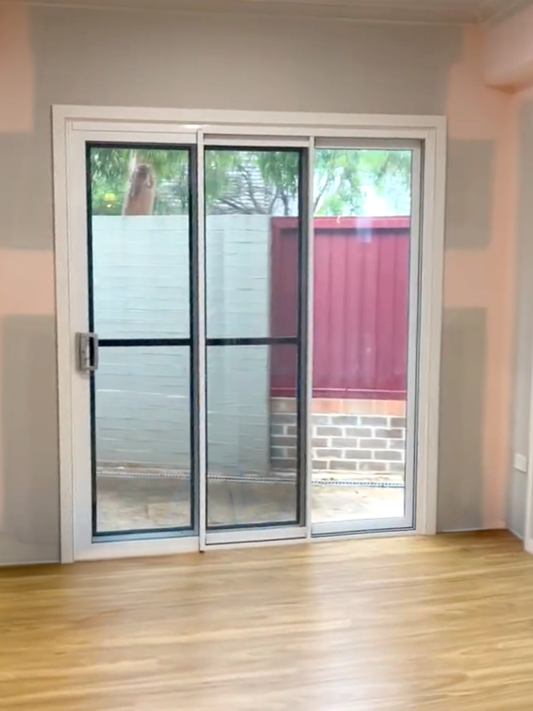 JDS Construction & Design - ScreenGuard security sliding doors on sliding doors opening to outdoor area installed by Olsen Security