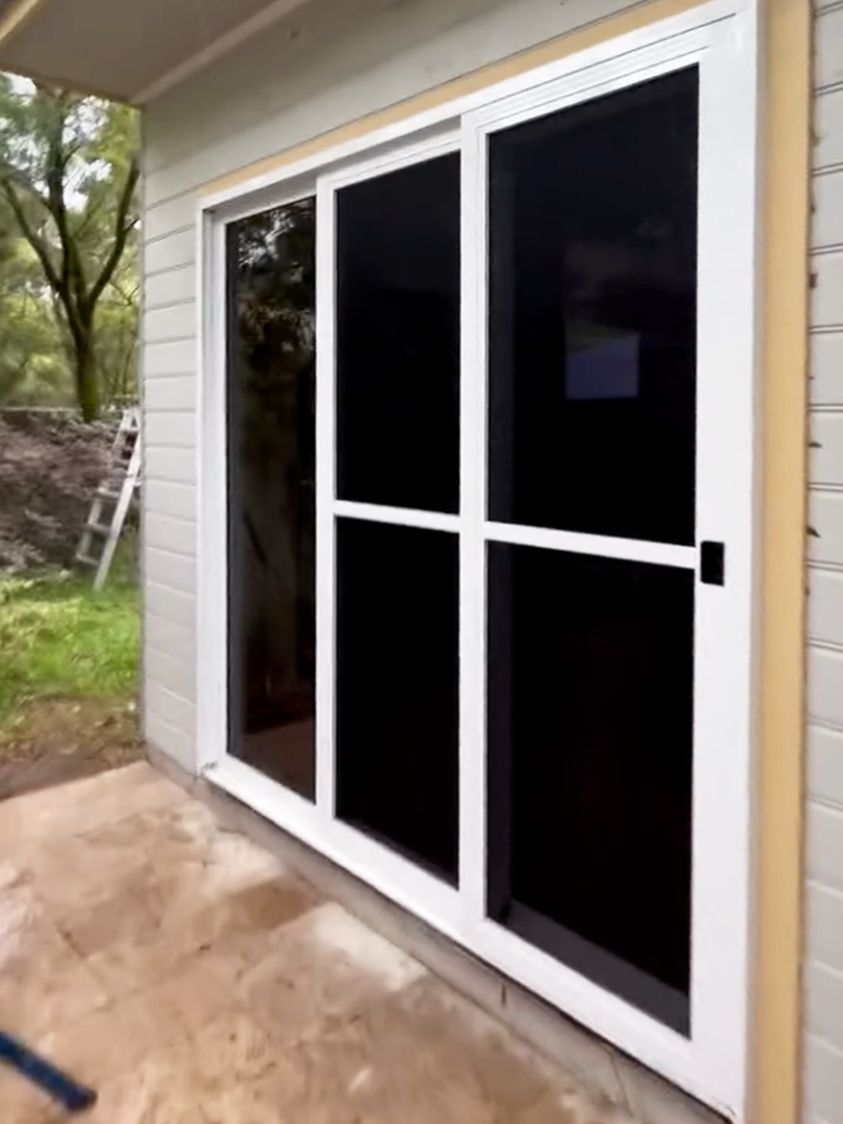 JDS Construction & Design - ScreenGuard security sliding doors on sliding doors opening to outdoor area installed by Olsen Security