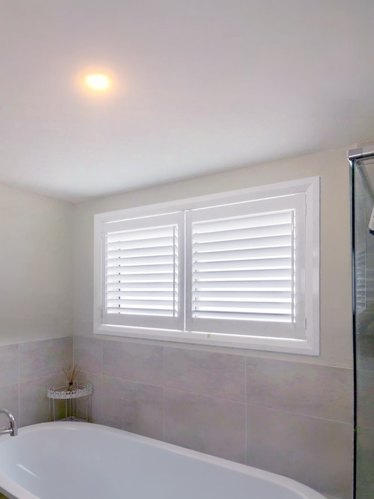 Plantation shutters, blinds, shades & privacy screens Plantation shutters on sliding windows in bathroom installed by Olsen Security