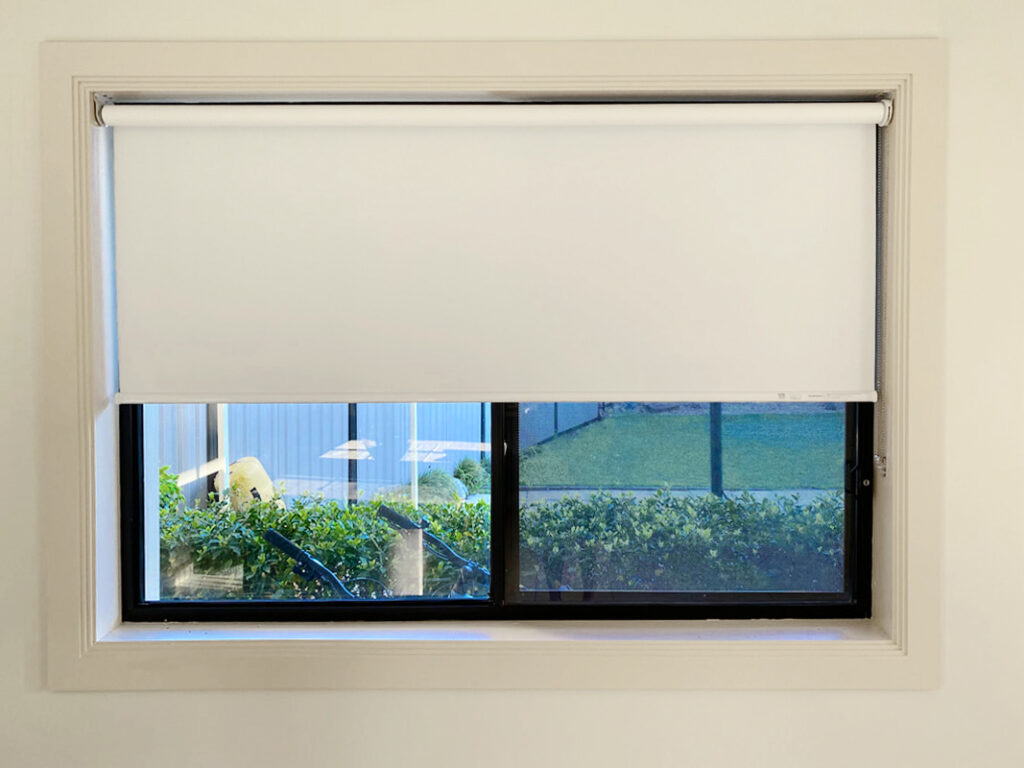 Plantation shutters, blinds, shades & privacy screens Roller blinds on sliding windows in kitchen installed by Olsen Security